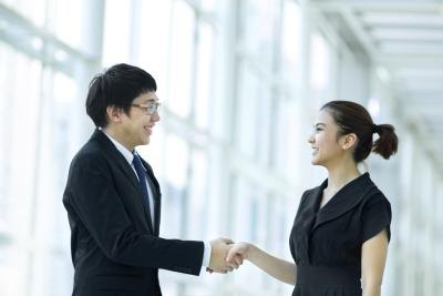 Business partners shaking hands Business partners shaking hands