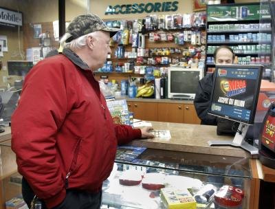 Man buying lottery ticket in Warren, Michigan Man buying lottery ticket in Warren, Michigan