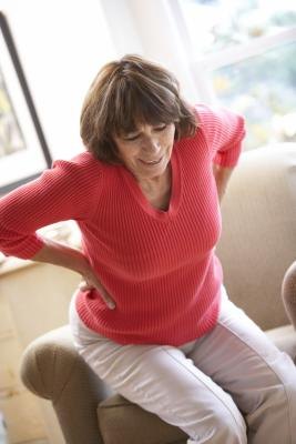 Woman sitting in pain
