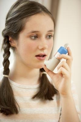 Child with asthma inhaler