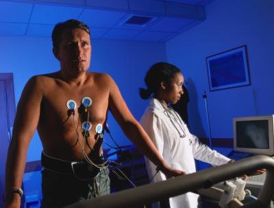 A patient runs on a treadmill as part of a stress test.