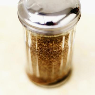 A close-up of a jar of evaporated can juice crystals.