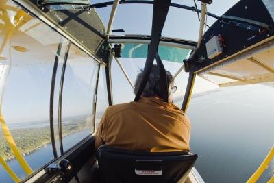 A man flies a home built floatplane.