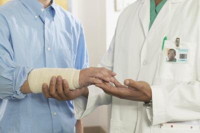 Weakness in the wrist is another common symptom.