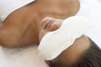 Woman with eye compress
