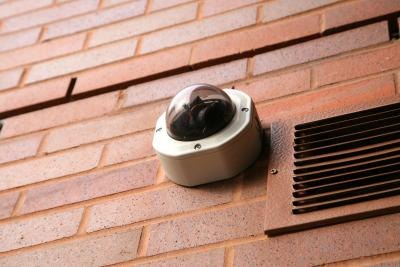 Surveillance camera on wall