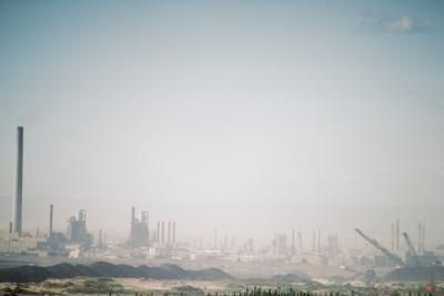 Smog settles over an industrial park. Smog settles over an industrial park.