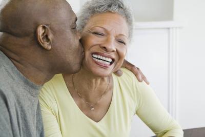 Man kissing wife