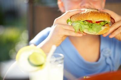 Boy eating at outdoor party