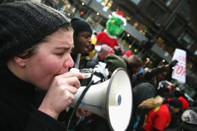 Workers gather to protest low wages. Workers gather to protest low wages.