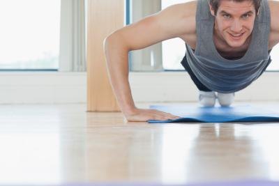 Doing push ups.