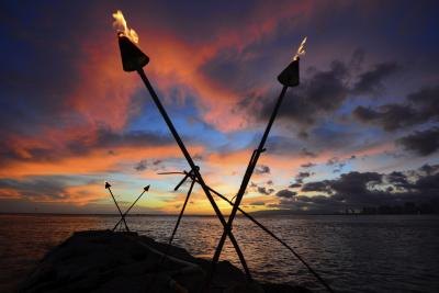 Tiki torches at sunset