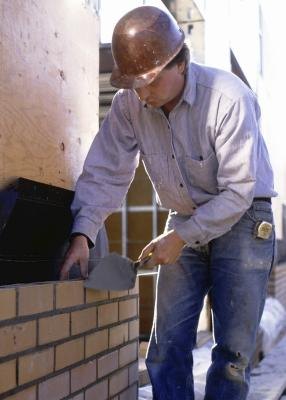 These bricks are pressed into a mortar bed and stuck together at each end joint with smeared mortar.