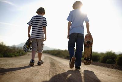 Adolescent boys skateboarding