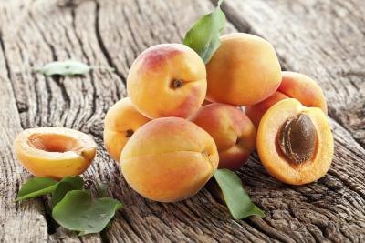 Fresh apricots on a wooden table