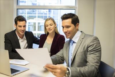 Investment banker speaking with clients