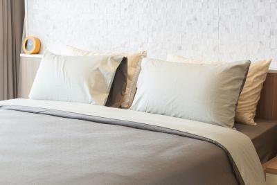 Choose a bedspread that reaches the floor to avoid the need for a bedspread.