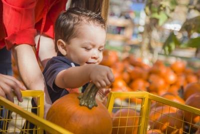Child with pumpkin