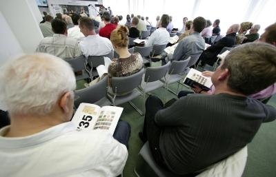 Collectors at stamp auction