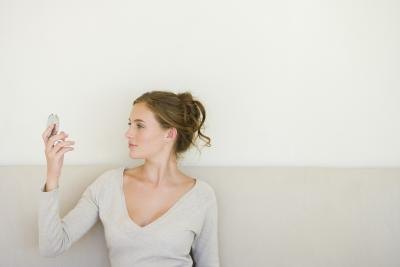 Female looking in mirror. Female looking in mirror.