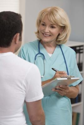 Happy nurse with patient