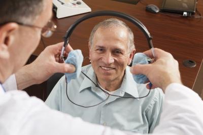 A hearing test is given to patients by the use of a headset.