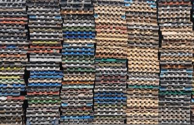 Stockpile of colorful wooden pallets