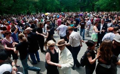 Couples swing dance in honor of legendary Lindy Hop pioneer Frankie Manning