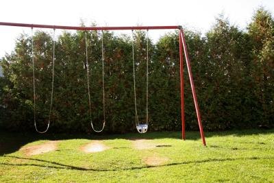The swing set is an icon of the American backyard. The swing set is an icon of the American backyard.