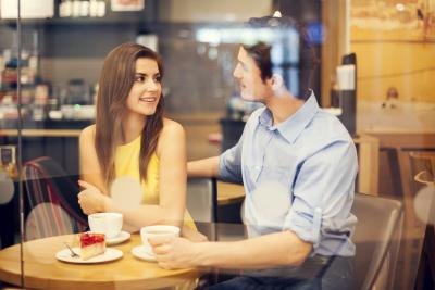 Couple talking over coffee