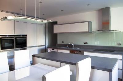 Long, narrow buffet-styled table in kitchen