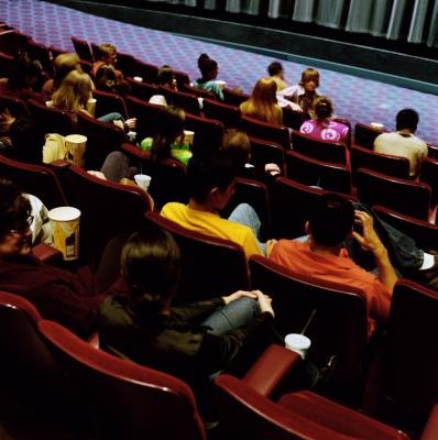 Young people sitting in movie theater