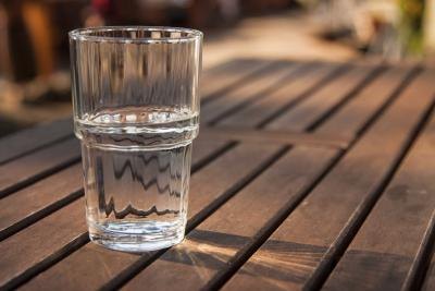 Glass of water on wood table