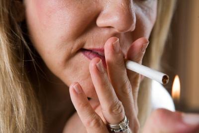 Woman lighting cigarette
