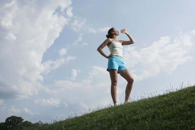 Woman drinking from water bottle