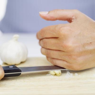 Put chopped up, grated or ground garlic into your food.
