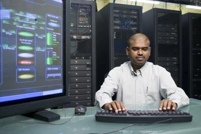 Computer technician working in server room