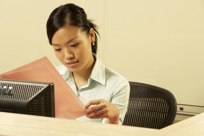 woman looking at paperwork