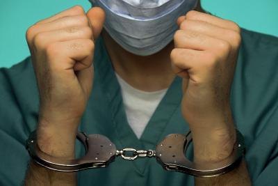 Doctor in handcuffs