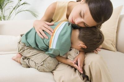 Mother hugging son