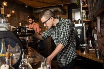 Barista in action making a latte