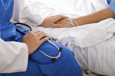 Doctor with patient in hospital.