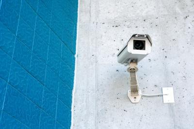 Surveillance camera on wall