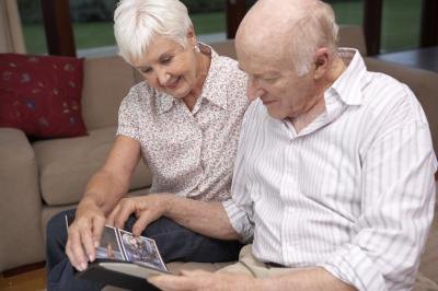 couple looking at photos from reunion