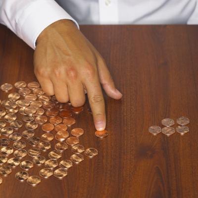 Man sorting through pennies