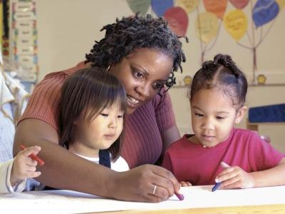 Preschool teacher with children