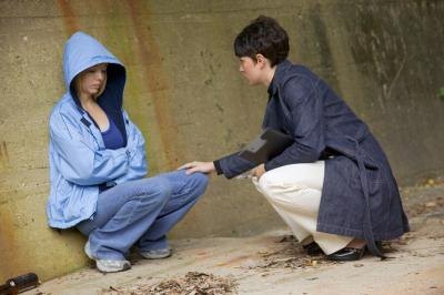 Woman talking to run away teen