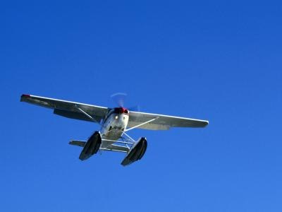 A single prop floatplane comes in for a landing. A single prop floatplane comes in for a landing.