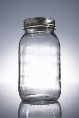 An empty canning jar holds infinite candle possibilities. An empty canning jar holds infinite candle possibilities.