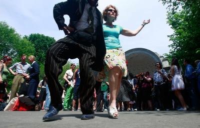 Couple swing dance in Central Park, NY Couple swing dance in Central Park, NY